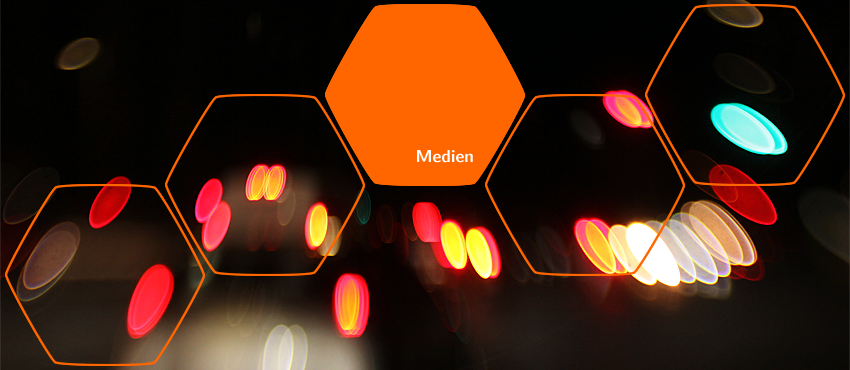 Header-Bild für das Thema Medien. Im dunklen Hintergrund befinden sich bunte Lichtflecken. Header-Bild für das Thema Medien. Im dunklen Hintergrund befinden sich bunte Lichtflecken.